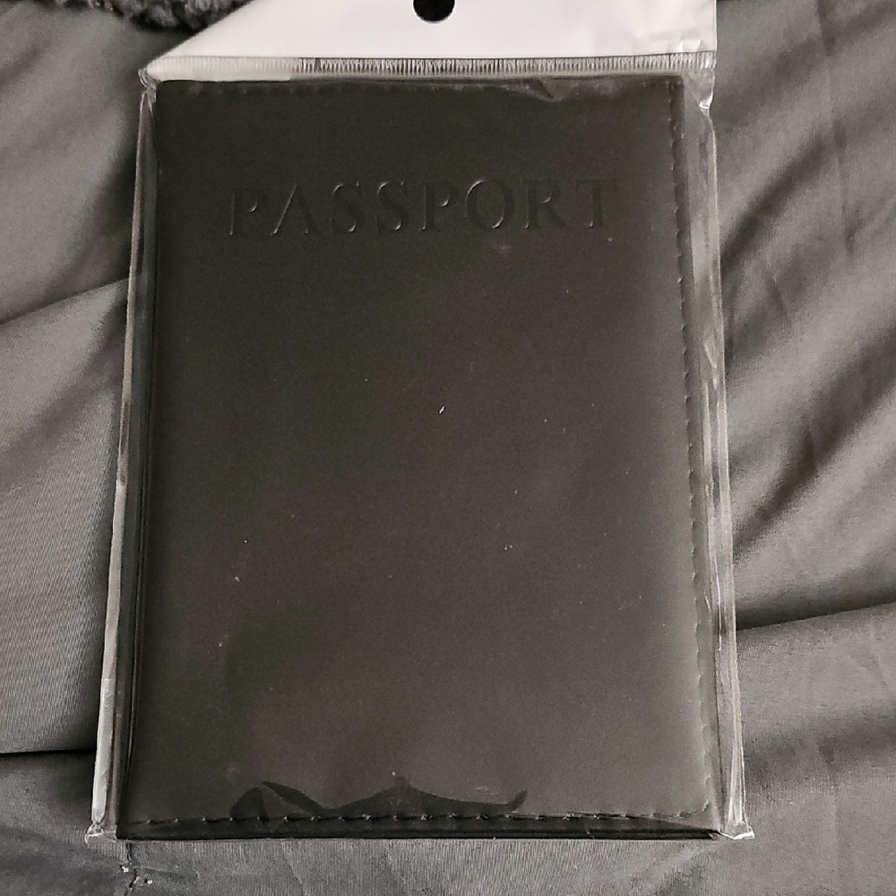 Source Unknown Black Passport Holder